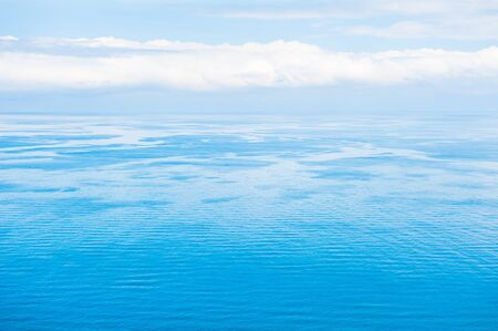 Blue sea background. Beautiful seascape and the blue sky with cloudsの写真素材