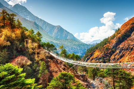 Suspension bridge in Himalaya mountains, Nepal. Khumbu valley, Everest region, Sagarmatha national parkの写真素材