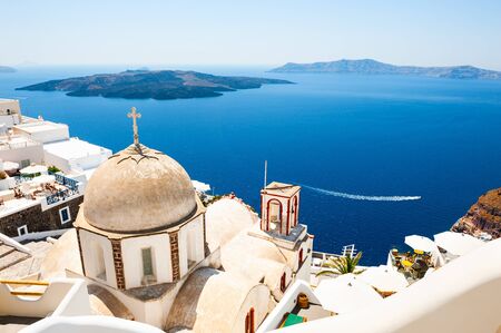 Santorini island, Greece. Old church and view of the sea and islands. Famous travel destinationの写真素材