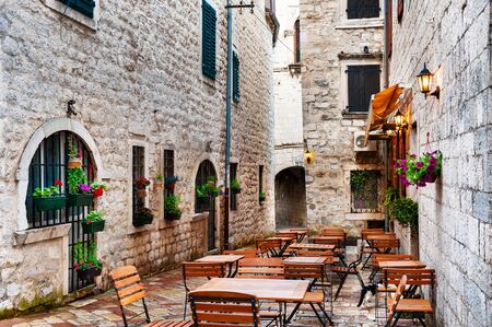 Cafe on the street in Old Town in Kotor, Montenegro. Famous travel destination.の写真素材