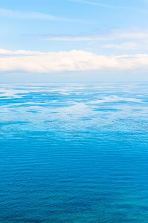 Blue sea and sky with white clouds. Beautiful nature backgroundの写真素材