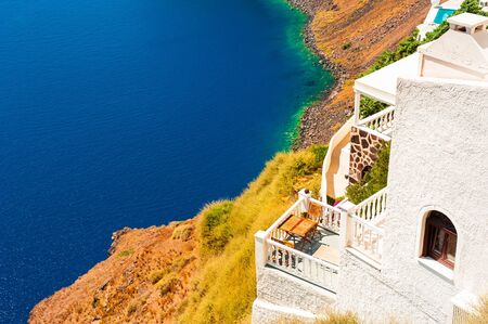 Santorini island, Greece. House on the sea shore. Famous travel destinationの写真素材