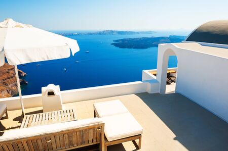White architecture on Santorini island, Greece. Beautiful sea view. Famous travel destinationの写真素材