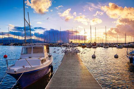 Beautiful sunset on the shore of Lake Geneva in Lausanne, Switzerlandの写真素材