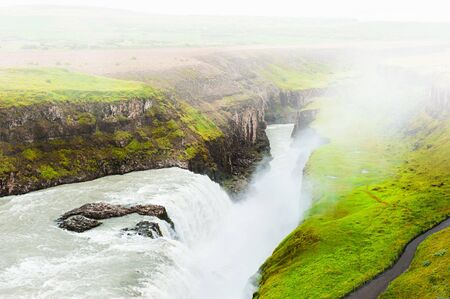 Gullfoss waterfall in foggy day, Iceland. Summer landscapeの写真素材