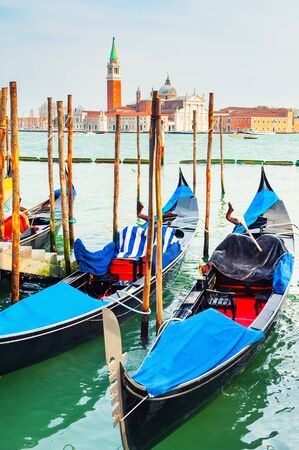 Gondolas on the Grand canal near San Marco square in Venice, Italy. San Giorgio Maggiore Cathedral in the backgroundの写真素材