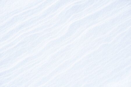 Snow cover in a field after blizzard. Abstract winter background.の写真素材
