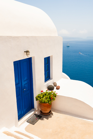White architecture on Santorini island, Greece. Traditional greek houses with blue doors and windowsのeditorial素材