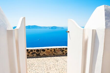 White architecture on Santorini island, Greece. Beautiful terrace with sea view.の写真素材