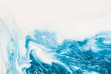 Abstract acrylic paint background. Texture made by hand with white and blue pearly paints on the...