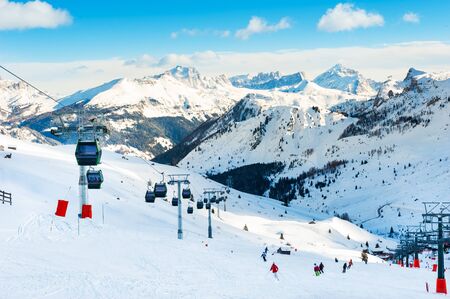Ski slopes on ski resort in winter Dolomite Alps. Val Di Fassa, Italy. Winter holidays, travel destinationの写真素材