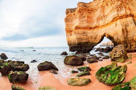 Rocks on the shore of Atlantic ocean in Algarve region in south Portugal. Beautiful summer seascapeの写真素材