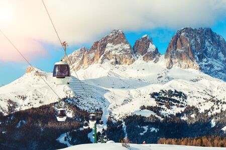 Ski lift on ski resort in winter Dolomite Alps. Val Di Fassa, Italy. Winter holidaysの写真素材
