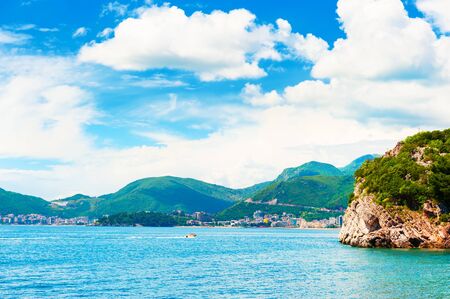 Beautiful beach with turquoise water and cliffs near Budva, Montenegro. Summer seascape, travel and vacationの写真素材