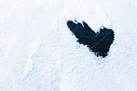 Shape of heart with snow and ice. Winter nature backgroundの写真素材