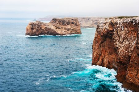 Rocky coast of Atlantic ocean in Cape St. Vincent, Algarve, Portugal. This is the most South-Western point of Europeの写真素材