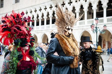 Venice, Italy - Februrary, 15, 2020: People wearing carnival masks at traditional Venice Carnival, San Marco squareのeditorial素材