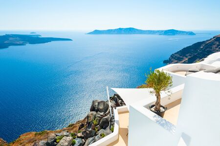 White architecture and blue sea on Santorini island, Greece. Summer holidays, travel destinations conceptの写真素材