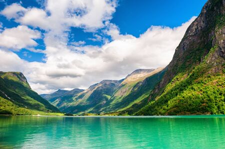 Beautiful lake with green water in the mountains in Norway. Summer landscapeの写真素材