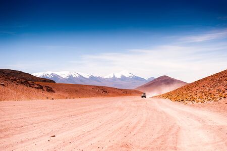 Off-road cars driving on the road in the desert on plateau Altiplano, Bolivia.  South America landscapesの写真素材