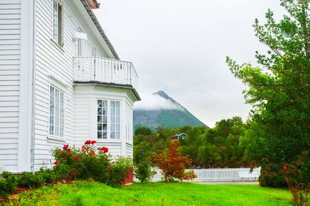 Wooden house with beautiful garden in Norway. Summer landscapeの写真素材