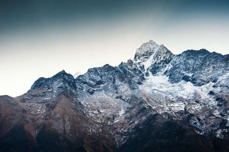 Himalaya mountain range against the blue sky at sunrise. Thamserku peak. Khumbu valley, Himalayas, Everest region, Nepalの写真素材