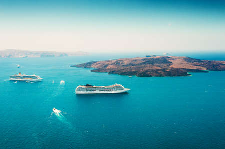 Cruise ship in the sea near Santorini island, Greece. Beautiful sea view. Famous travel destination