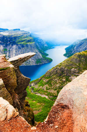 Panoramic view of Trolltunga landmark in Norway. Beautiful summer landscape, view of lake with mountains. Famous travel destinationの写真素材