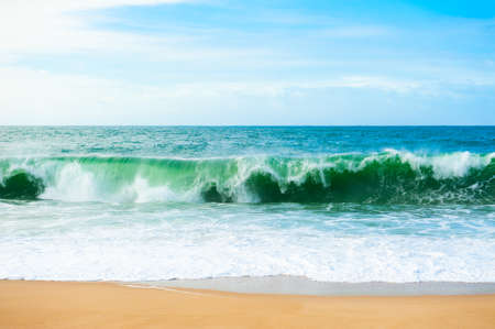 Waves on the coast of Atlantic ocean. Algarve, Portugal. Beautiful beach with white sand and turquoise water. Summer nature background.の写真素材