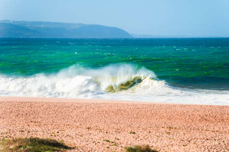 Waves on the coast of Atlantic ocean. Algarve, Portugal. Beautiful beach with white sand and turquoise water.の写真素材