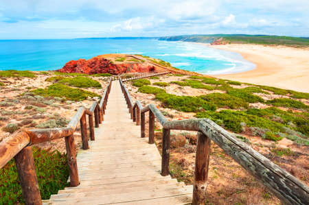 Beautiful shore of Atlantic ocean and stairs to the beach. Algarve, Portugal. Famous travel destinationの写真素材