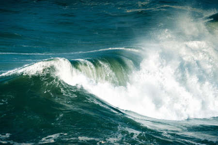 Big waves on the coast of Atlantic ocean in Nazare, Portugal. Beautiful seascape