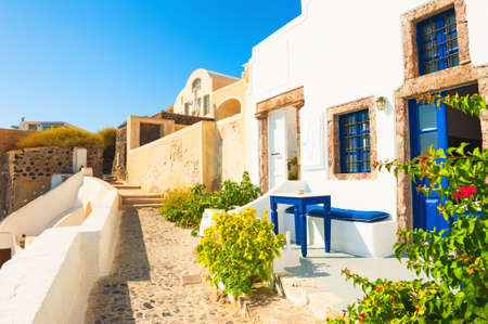 Traditional greek white architecture with blue doors and windows. Santorini island, Greece.の写真素材