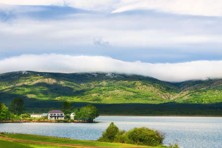 Lake in the mountains in early spring. Beautiful landscape in South Ural, Russia.の写真素材