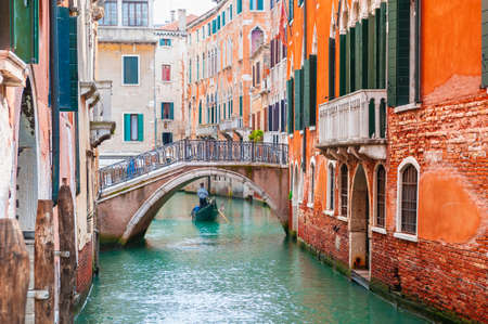 Beautiful canal with old medieval architecture and bridge in Venice, Italy. Famous travel destinationの写真素材