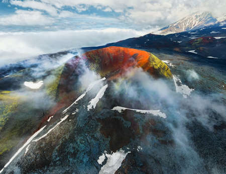 Volcano craters and black lava fields near Tolbachik volcano in Kamchatka peninsula, Russia. Aerial drone view. Kleshnya crater of Tolbachik volcanoの写真素材