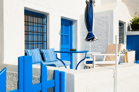 Traditional greek white architecture with blue doors and windows. Santorini island, Greece.のeditorial素材