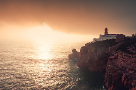 Lighthouse on Cape St. Vincent at sunset in Algarve, Portugal. Summer landscape. South-Western point of Europeの写真素材