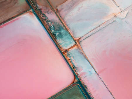Salt industry on the pink lake. Aerial top down view. Abstract nature background. Sasyk-Sivash salt lake in Crimea.の写真素材