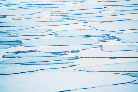 Melting ice floes on the lake. abstract nature background. Baikal lake, Siberia, Russia. beautiful spring landscapeの写真素材