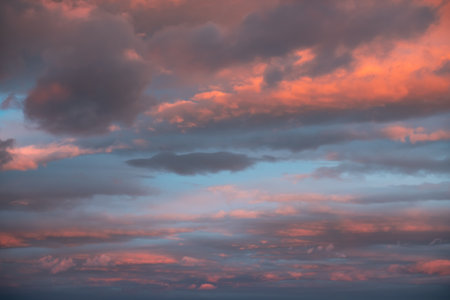 Blue sky with pink and purple clouds at sunset. Abstract sky nature background. Dramatic cloudscapeの写真素材