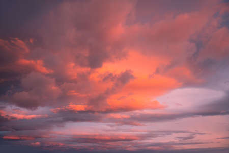 Blue sky with pink and purple clouds at sunset. Abstract sky nature background. Dramatic cloudscapeの写真素材