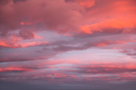 Blue sky with pink and purple clouds at sunset. Abstract sky nature background. Dramatic cloudscapeの写真素材
