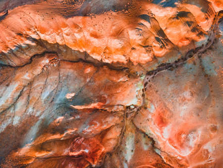 Red colorful mountains in Altai, Siberia, Russia. Aerial top down view. Kyzyl-Chin valley, also called as Mars valley. Abstract nature backgroundの写真素材