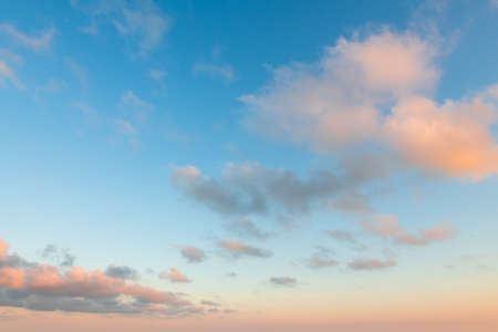 Blue sky with pink and purple clouds at sunset. Abstract sky nature background. Evening cloudscapeの写真素材