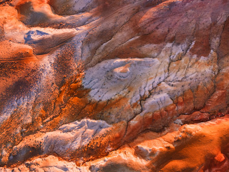 Red colorful mountains, abstract nature background. Aerial top down view. Kyzyl-Chin valley, also...