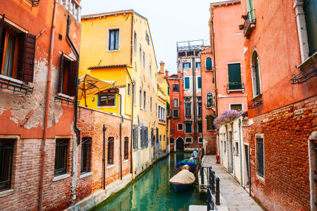 Old colorful architecture on the canal in Venice, Italy. Beautiful european cityscape. Famous travel destination.の写真素材