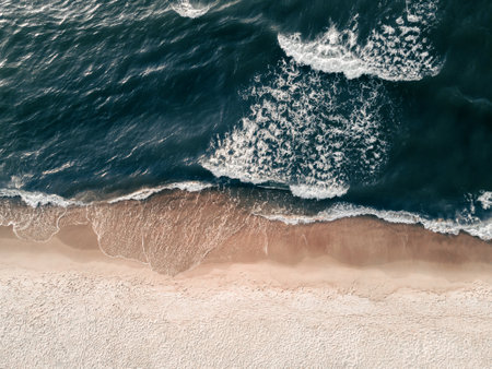 Beach with white sand and the blue sea. Aerial top down view. Abstract  summer nature background, travel and vacation conceptの写真素材