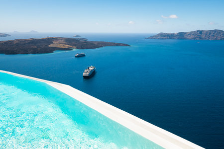 Santorini island, Greece. Luxury swimming pool with sea view. Travel and summer vacation conceptの写真素材