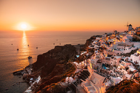 Beautiful sunset at Santorini island, Greece. Panoramic view. White architecture in Oia town. Summer travel and vacationの写真素材
